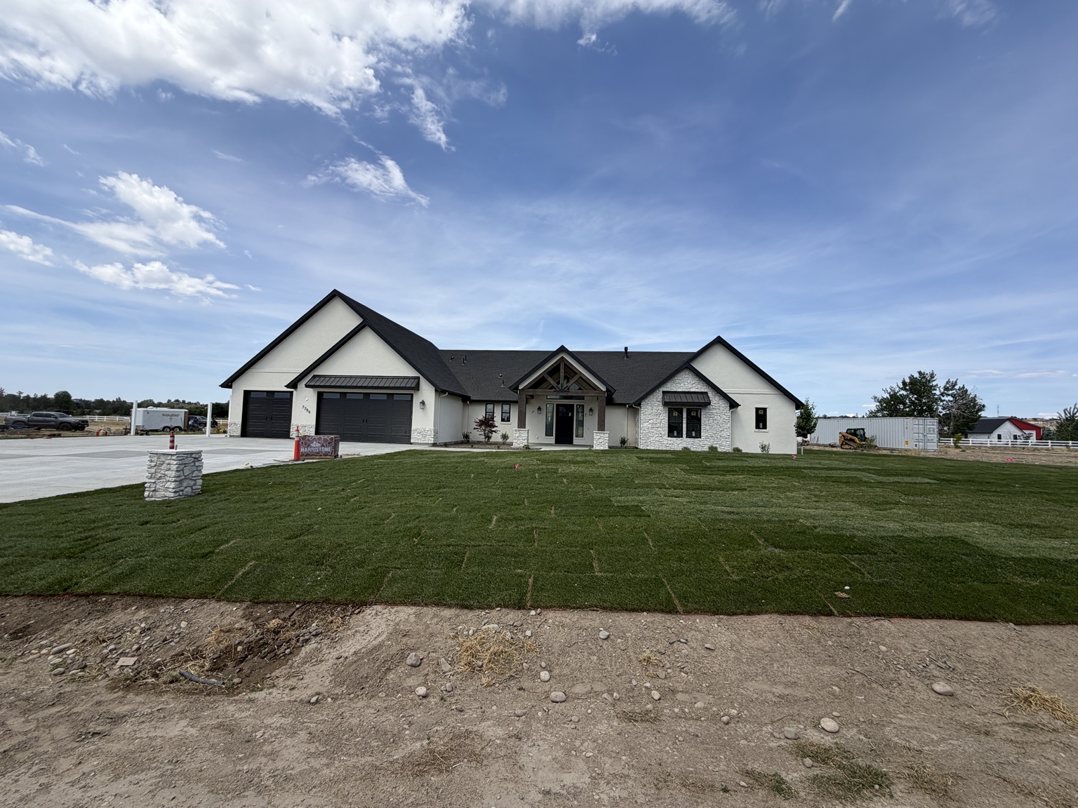Middleton home's front yard after landscaping with freshly installed green sod